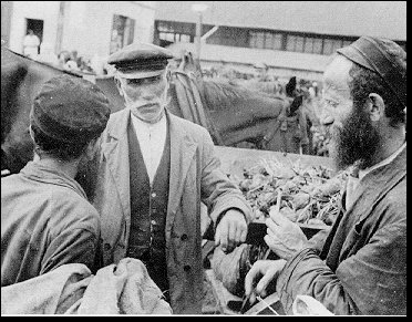 Fish Merchant Wheeling His Portable Fish Cart